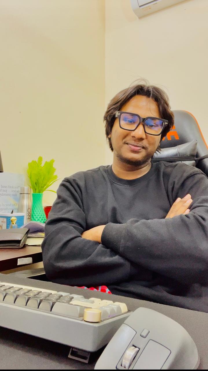 Najir Hossain at his desk in Sirajganj, building Explainerium.